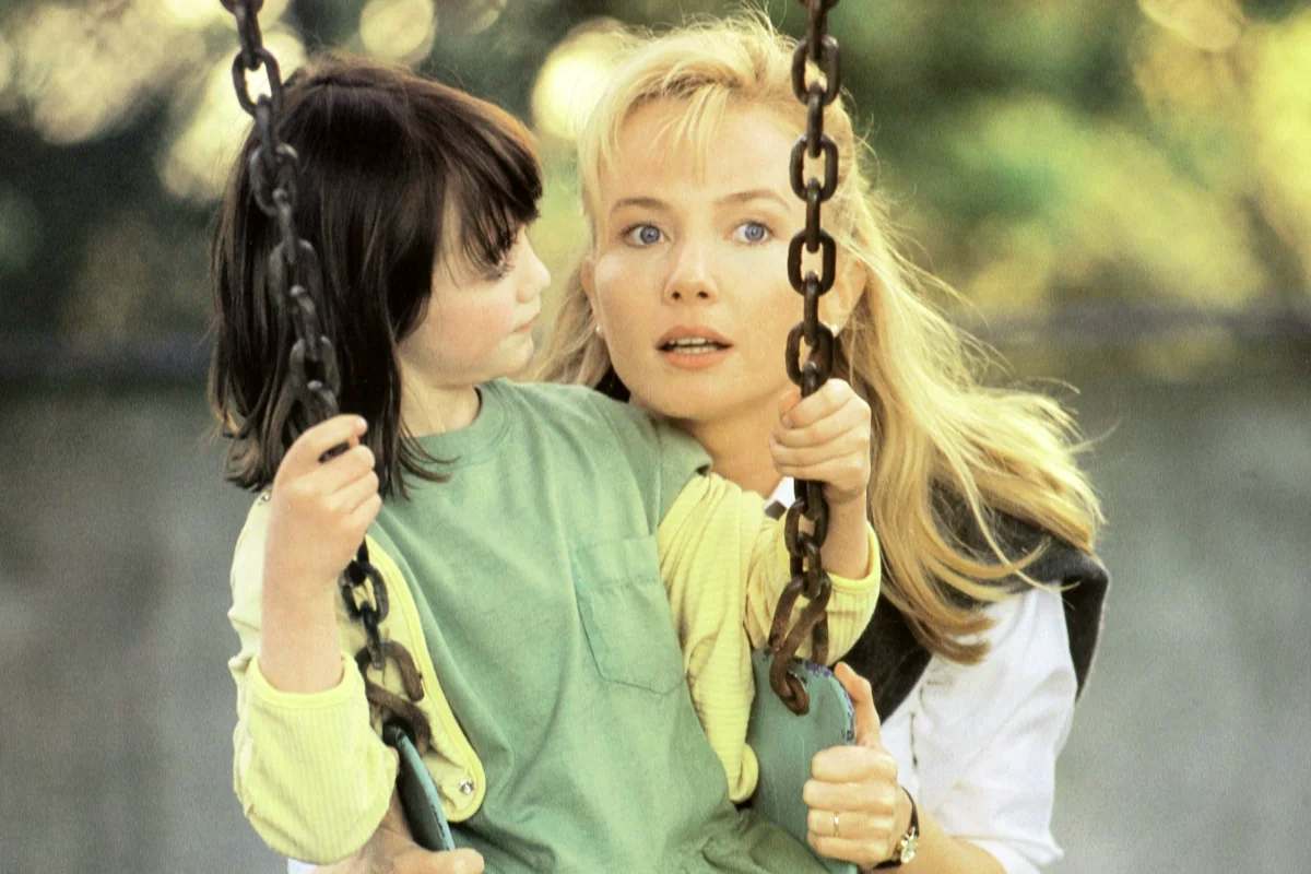 A suspenseful scene from The Hand That Rocks the Cradle, depicting trust, manipulation, and hidden danger.