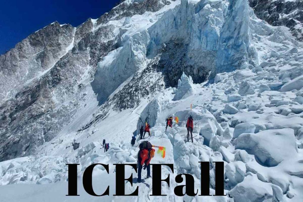 ICE Fall frozen waterfall under icy blue sky, high altitude.